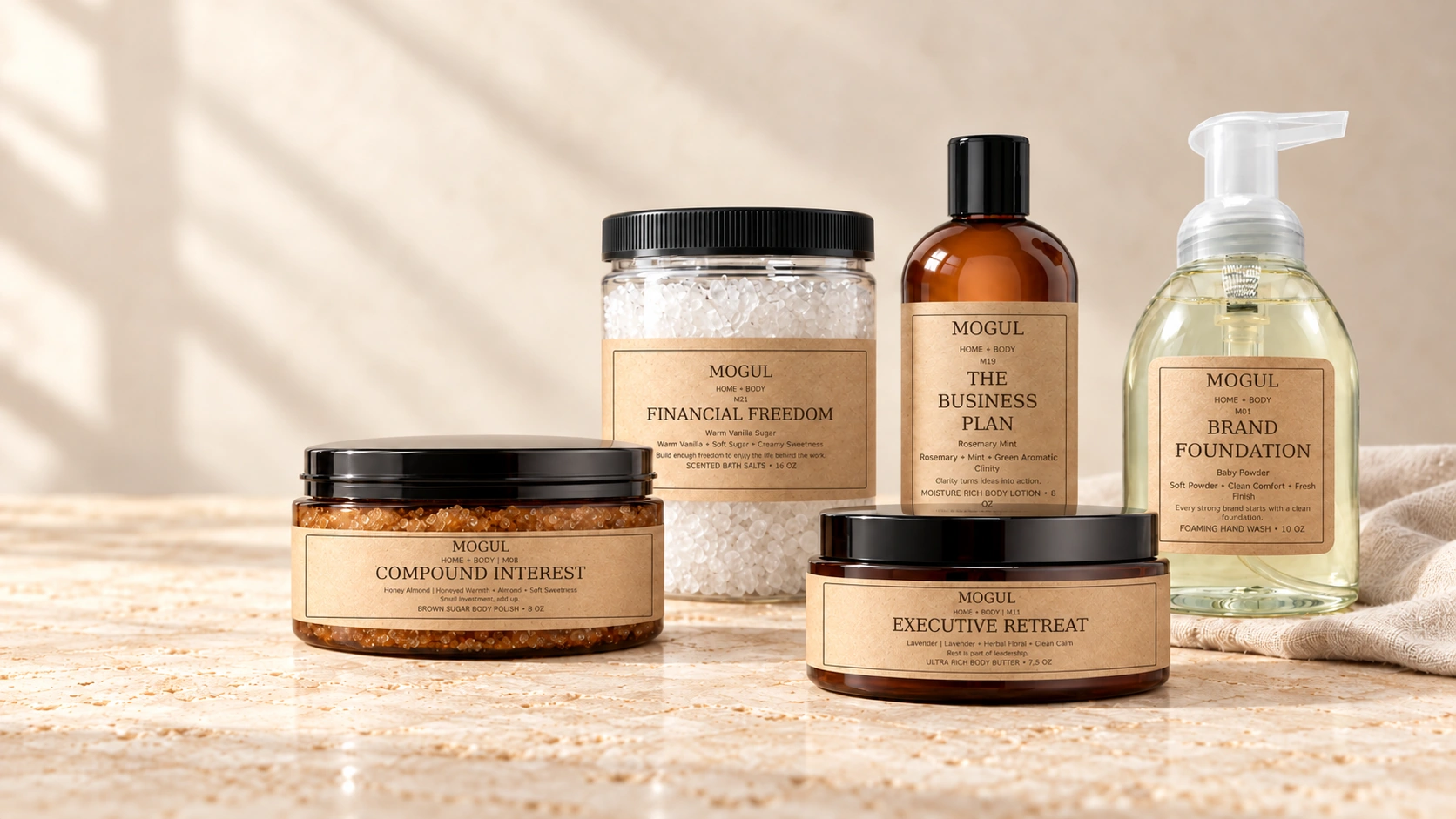 MOGUL HOME + BODY kraft-labelled COMPOUND INTEREST M08 body polish, FINANCIAL FREEDOM M21 white bath salts, THE BUSINESS PLAN M19 lotion, EXECUTIVE RETREAT M11 body butter and BRAND FOUNDATION M01 foaming hand wash